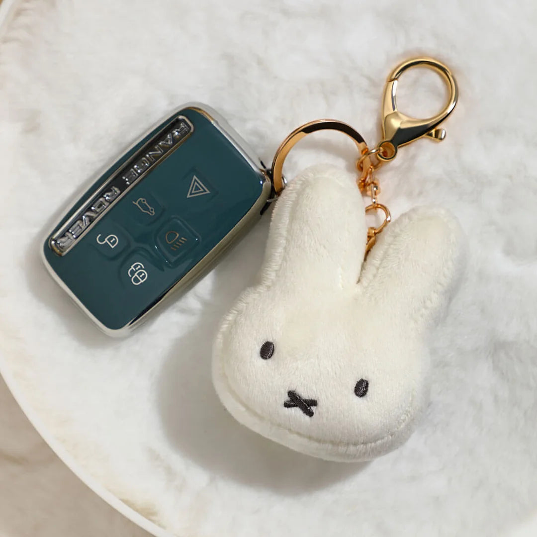 Miffy face plush keychain attached to car keys for size reference
