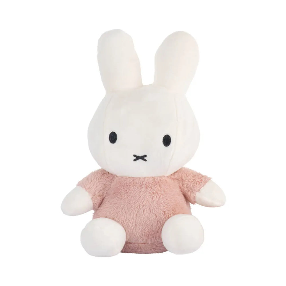 Plush toy rabbit in a pink outfit on a white background