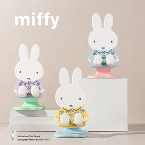 Three Miffy phone stands in different outfits, all part of Miffy blind box collection 