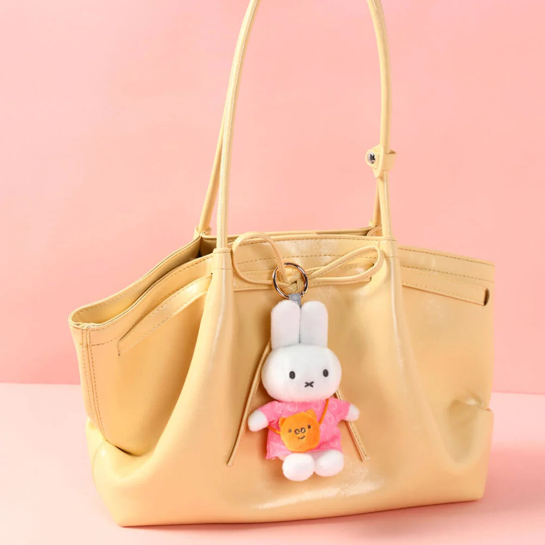 Miffy blind box. Bag clip Miffy with bag series. Display of Miffy with pink dress 