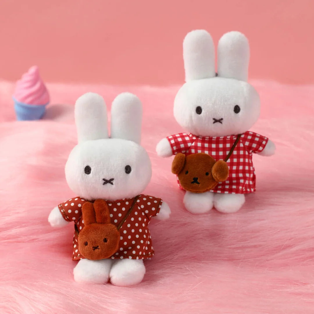 Miffy blind box. Display of two possible to collect. Miffy on polka dress or gingham dress variants. 