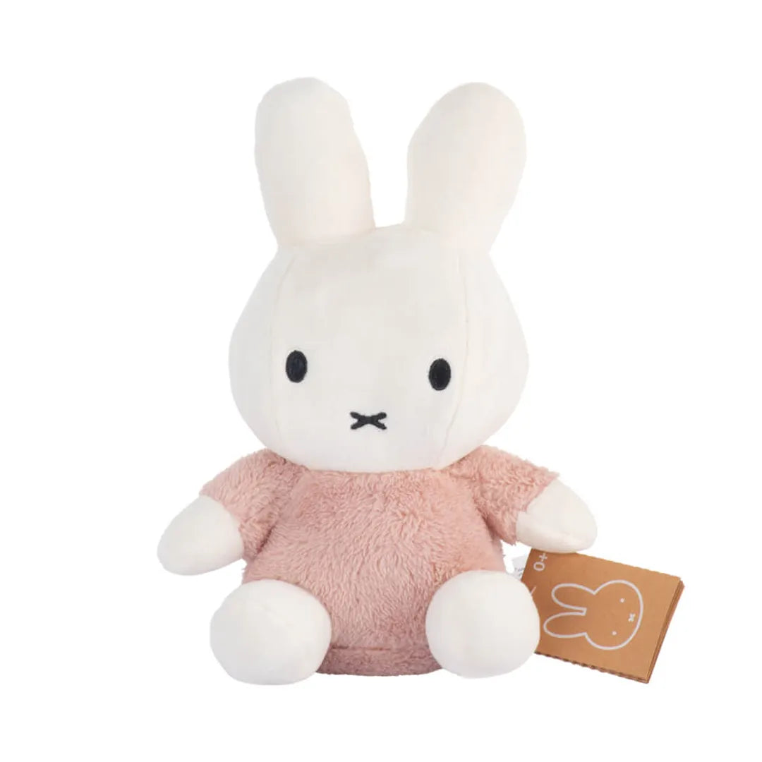 Miffy Plush toy rabbit with a pink outfit on a white background