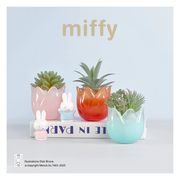 Decorative set with colorful planters and small miffy figurines on a light blue background.