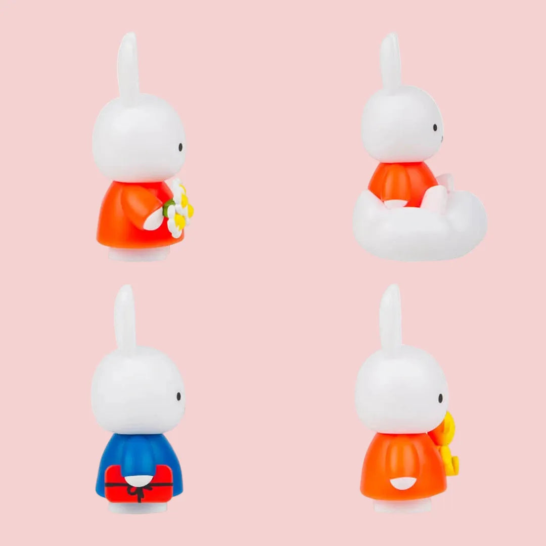 Four small figurines with different colored outfits. Miffy mystery ox. Brisbane stock 