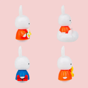 Four small figurines with different colored outfits. Miffy mystery ox. Brisbane stock 