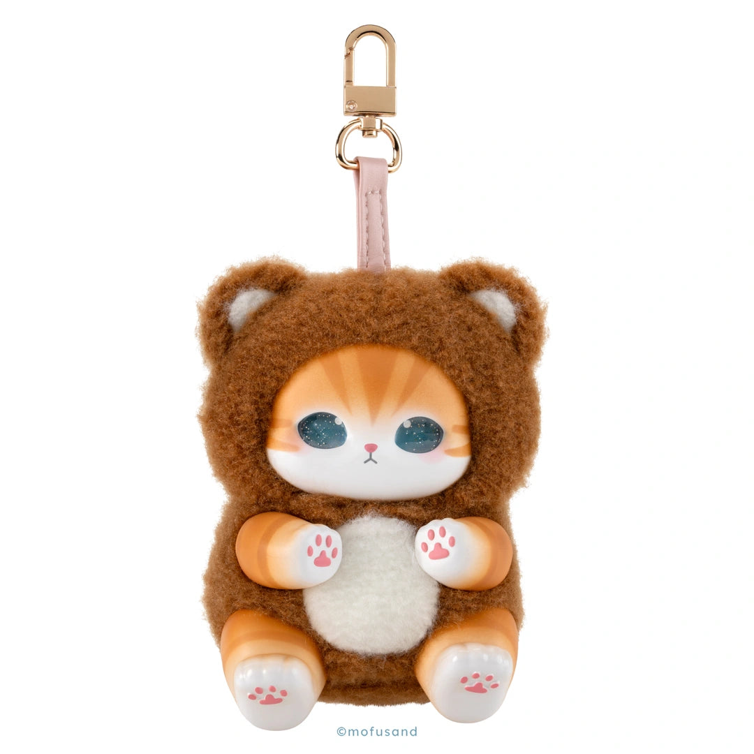 A plush keychain shaped like a cute orange-and-white cat in a brown teddy bear suit, with a gold-tone clasp and pink strap, shown on a plain white background.
