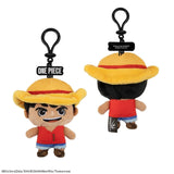 Plush keychain of a character from 'One Piece' with a yellow hat and red shirt on a white background.