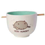 Front view of Pusheen Very Hungry noodle bowl with turquoise interior and chopstick holder – kawaii ramen bowl