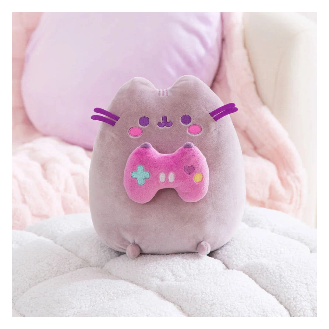 Pusheen Gamer plush on pink cosy bed setting