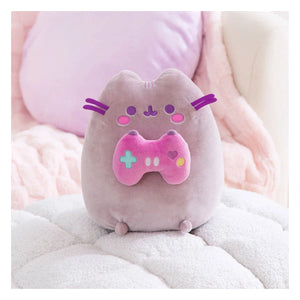 Pusheen Gamer plush on pink cosy bed setting