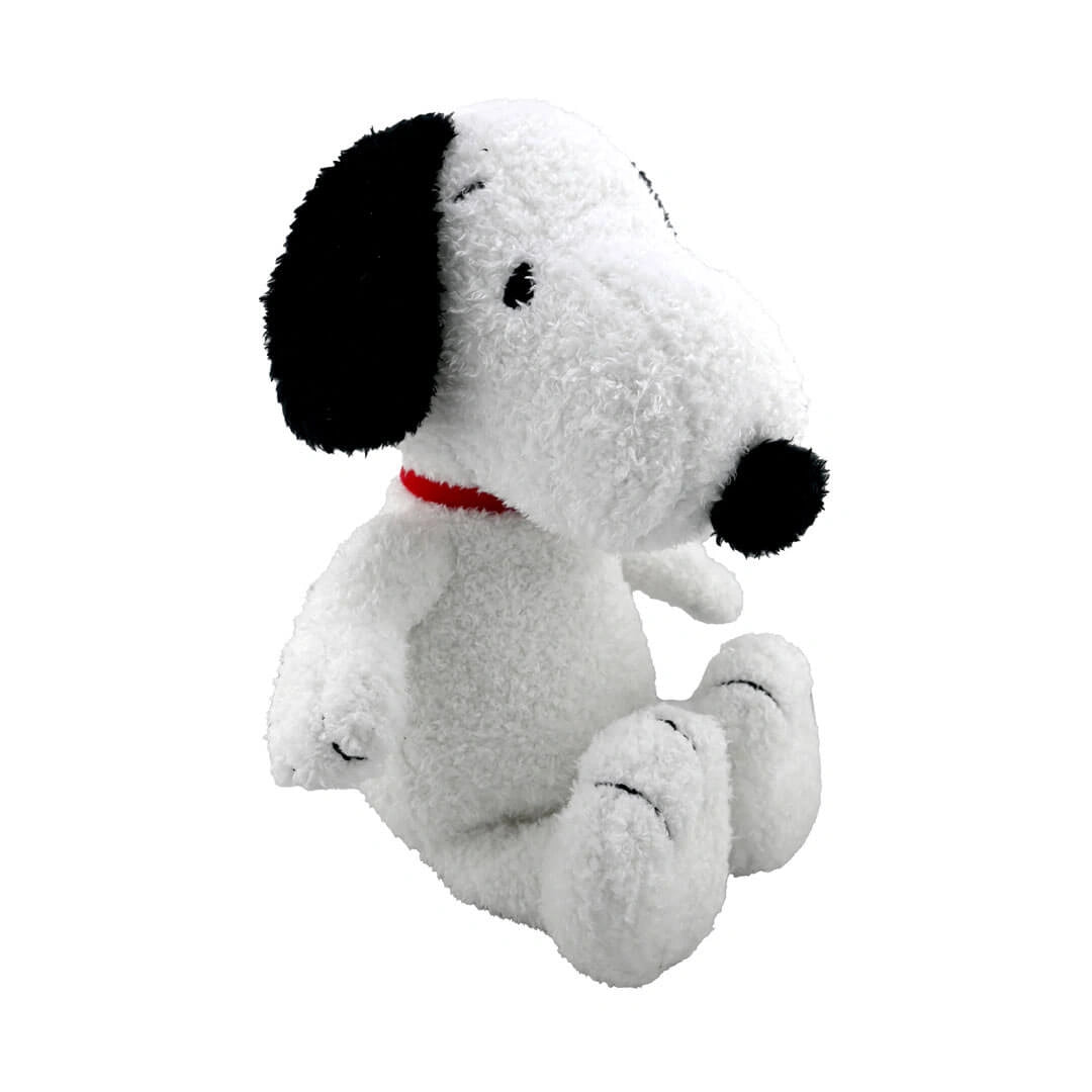 Plush toy of Snoopy  dog with a red collar on a white background