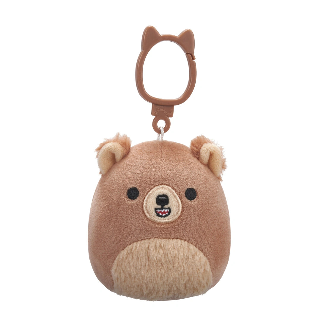 Plush bear-shaped keychain with a brown background