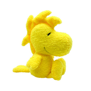 Yellow plush bird toy on a white background