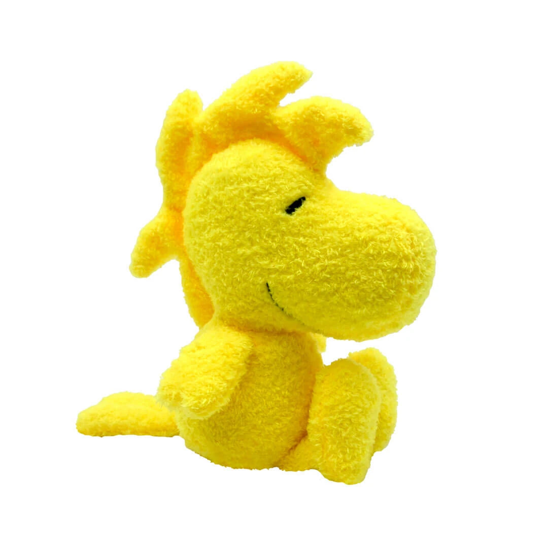 Yellow plush bird toy on a white background